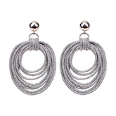Lulu Lightweight Sparkly Silver Hoops on a Stud Earring